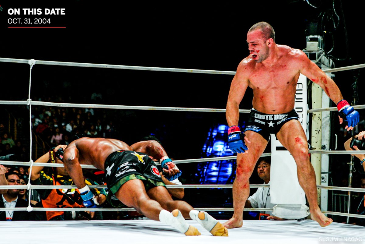 Following a flurry of knees, Silva sent an unconscious Jackson crashing through the ropes, leading to this now-iconic image captured by Susumu Nagao.